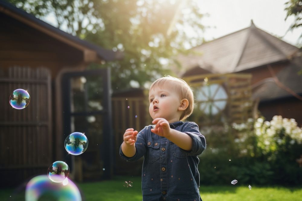 Kid playing bubble architecture outdoors backyard. AI generated Image by rawpixel.
