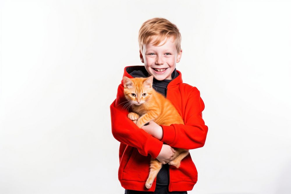 Kid smiling holding orange cat portrait mammal animal. AI generated Image by rawpixel.
