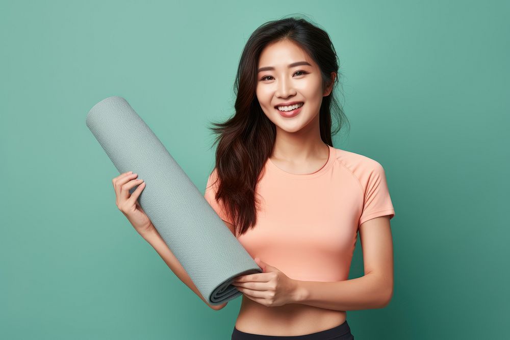 Yoga mat smiling holding sports. AI generated Image by rawpixel.