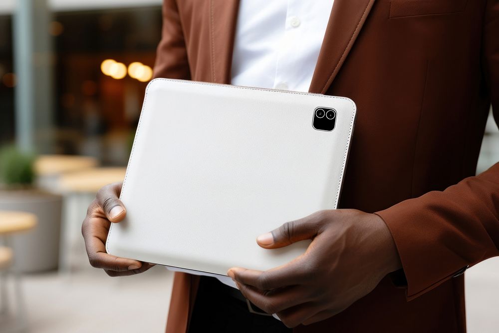 White leather case computer holding hand. AI generated Image by rawpixel.