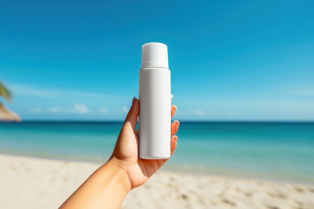 Sunscreen cream cosmetics bottle sea. 