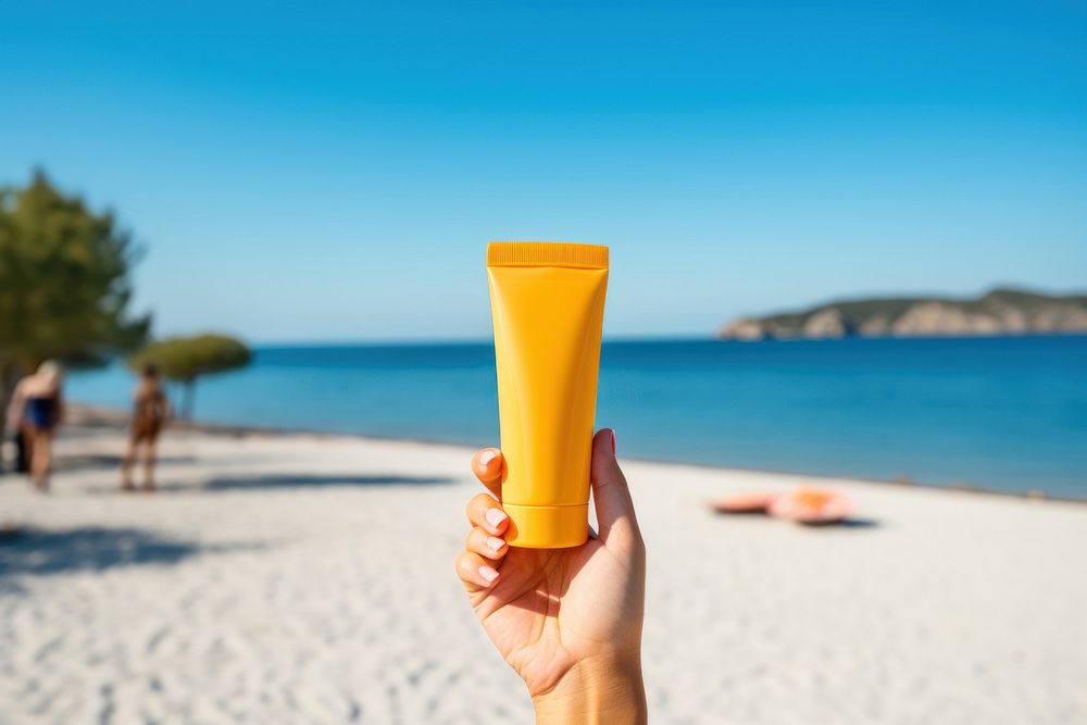 Sunscreen cream cosmetics outdoors holding. 