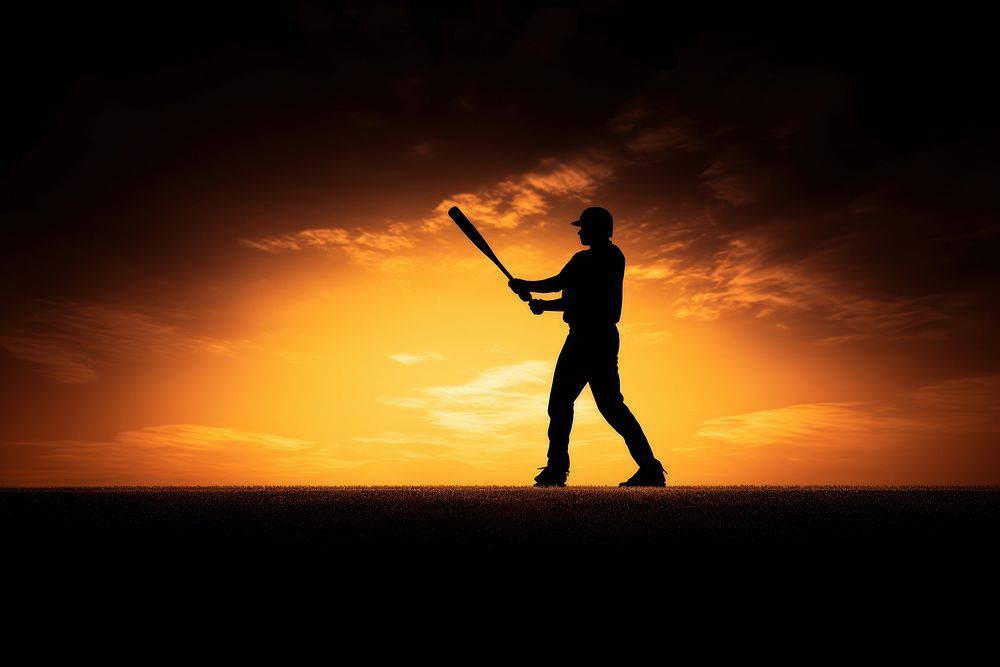 Baseball player backlighting silhouette sunset. 