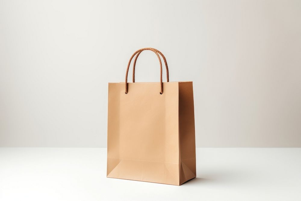 Shopping bag handbag paper white background. AI generated Image by rawpixel.