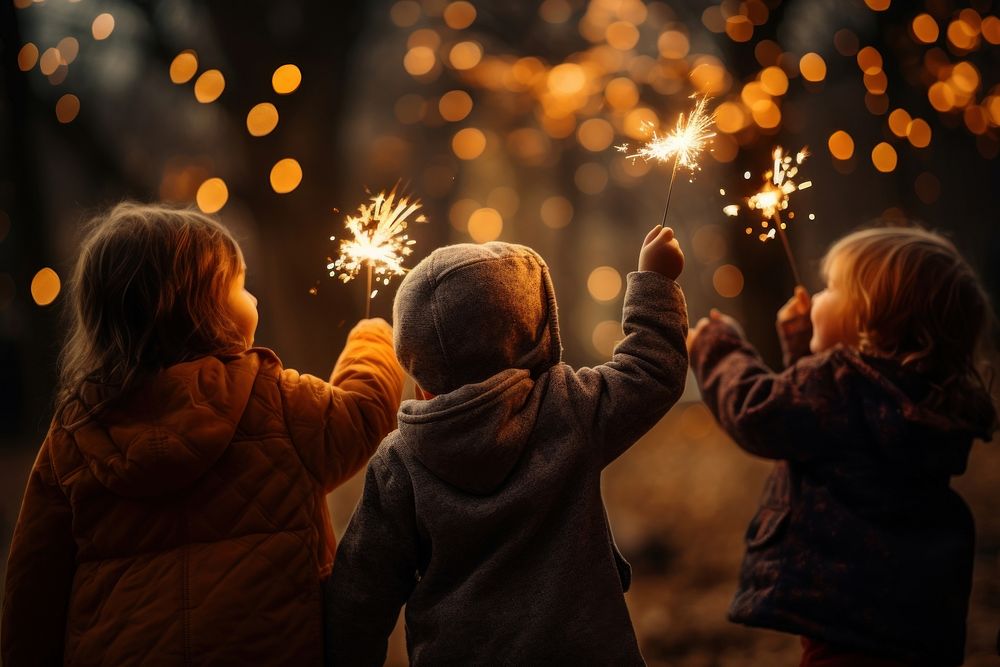 Sparkler outdoors sparks joy. 