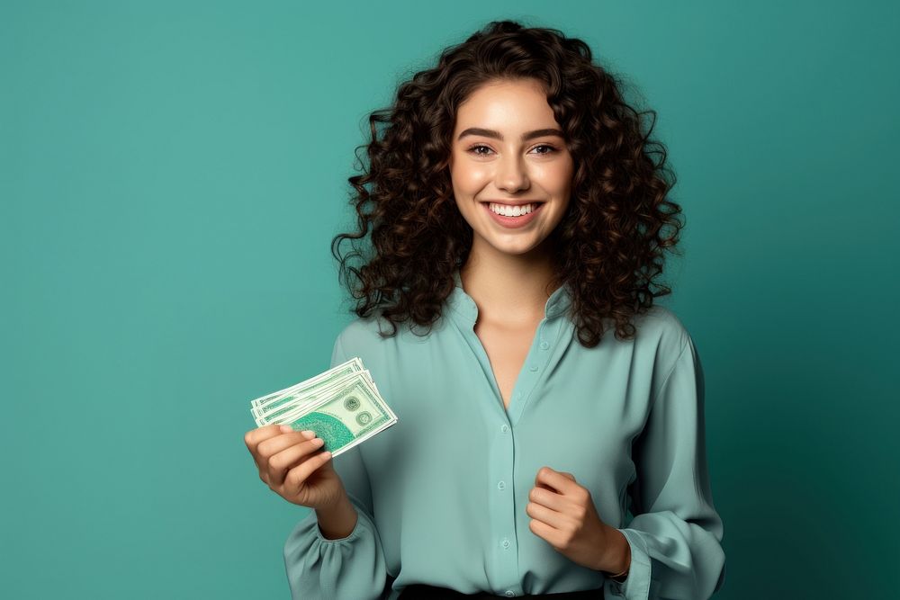 Young Women smile holding money. AI generated Image by rawpixel.