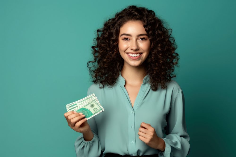 Young Women smile holding money. | Free Photo - rawpixel