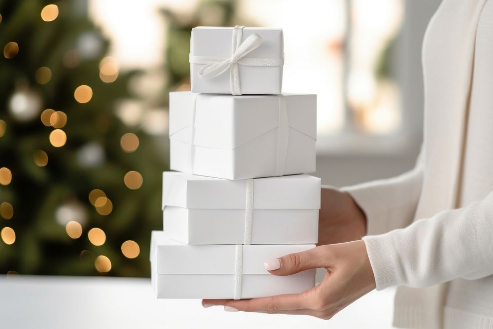 Gift box white hand anticipation. AI generated Image by rawpixel.