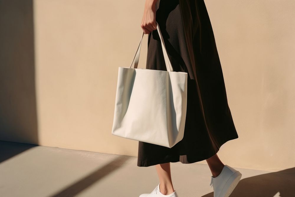 Tote bag footwear handbag shadow. AI generated Image by rawpixel.