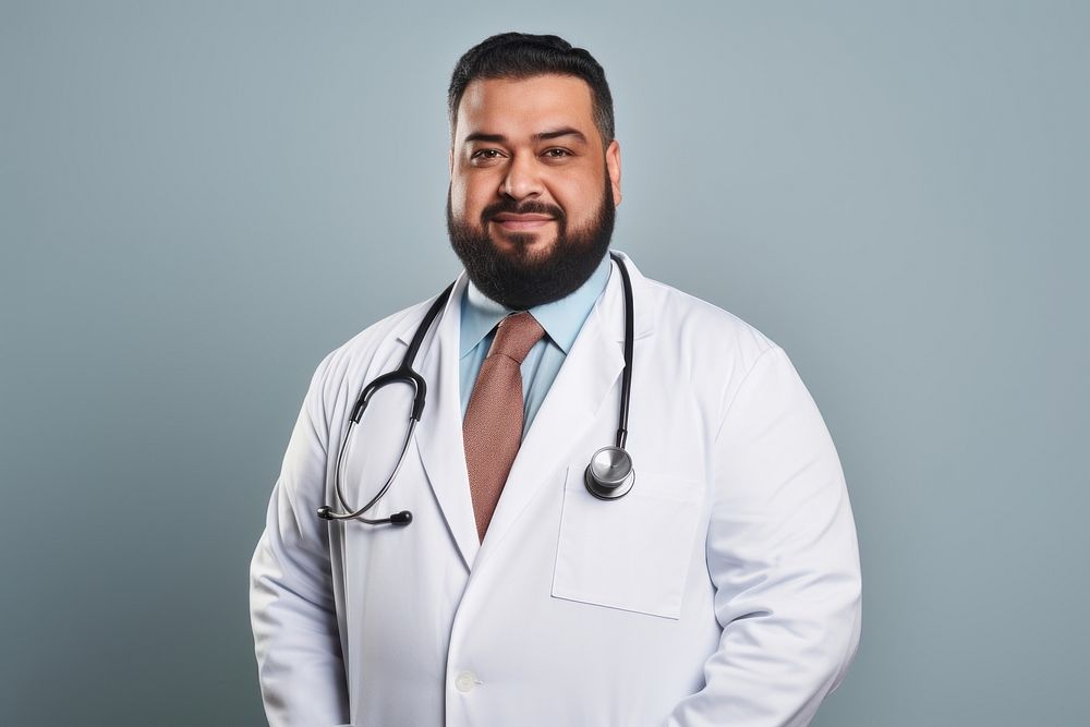 Plus size muslim male doctor smiling adult stethoscope. 