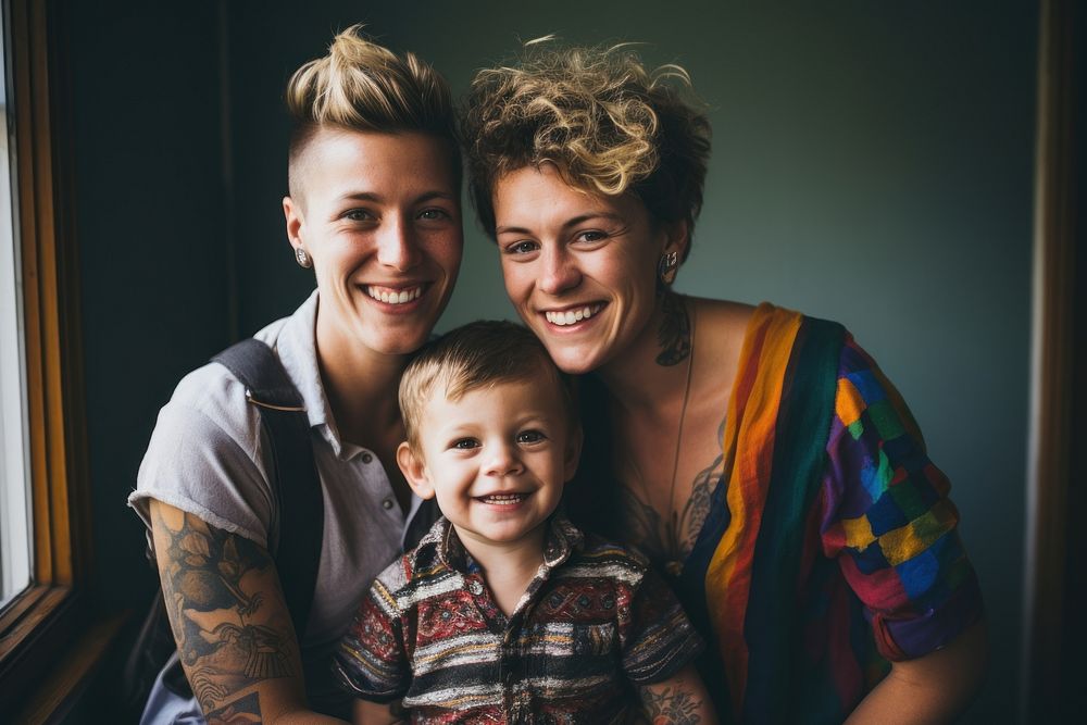 LGBTQ family laughing portrait child. 