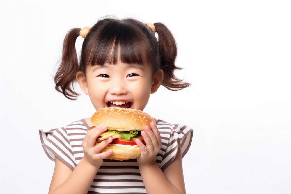 Cute little asian girl enjoy eating a hamburger have fun child food cute. AI generated Image by rawpixel.