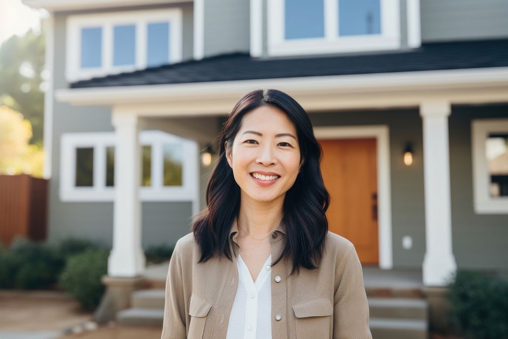 Smiling asian american woman standing house smile. AI generated Image by rawpixel.