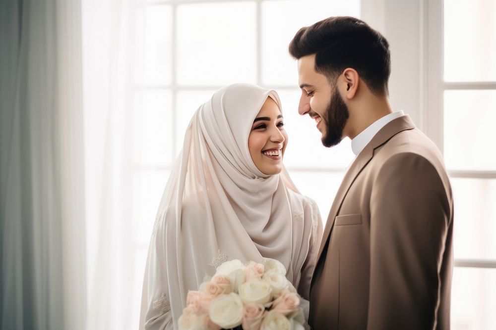 Cropped shot of muslim couple newlywed looking at each other, happy. AI generated Image by rawpixel.