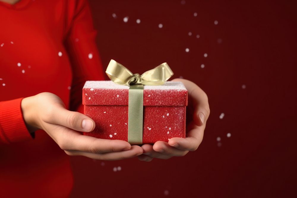 Christmas gift hand box red. AI generated Image by rawpixel.