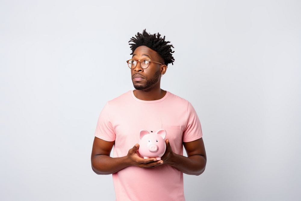 Piggybank t-shirt holding adult. AI generated Image by rawpixel.