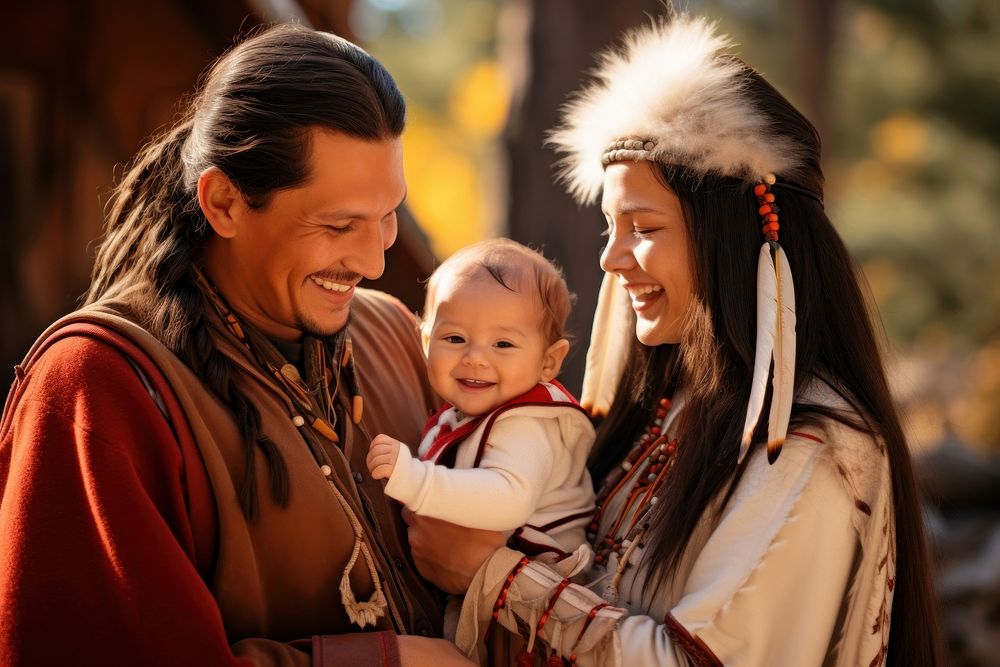 Native American family baby smiling adult. 