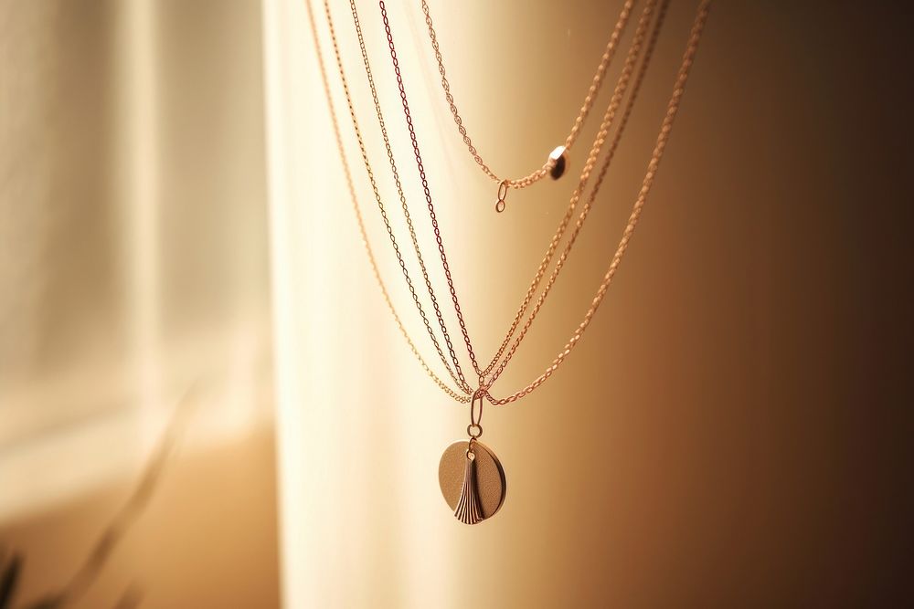 Elegant gold pendant necklace displayed.