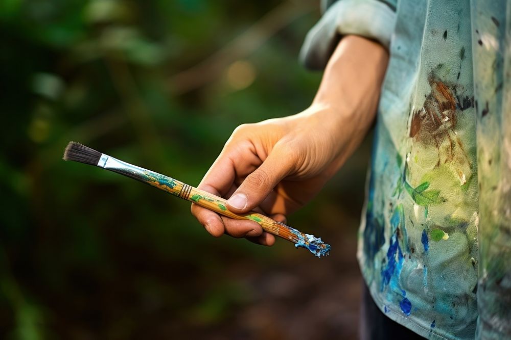 Artist brush cigarette outdoors. 