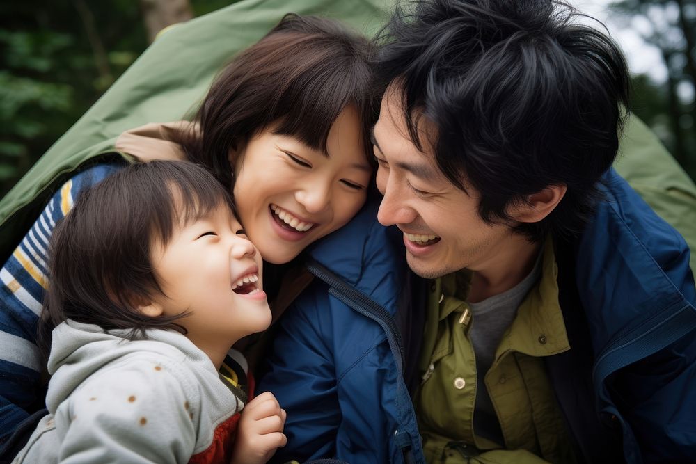 Asian family laughing portrait outdoors. AI generated Image by rawpixel.