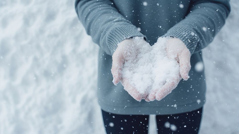 Holding snow glove outdoors hand. 