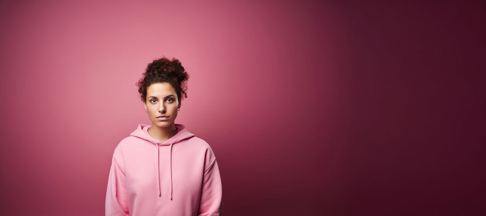 Woman wearing a pink sweatshirt portrait photo pink background. AI generated Image by rawpixel.