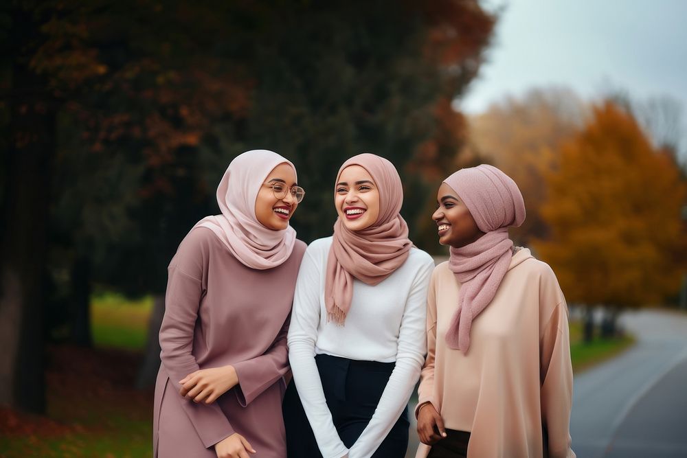 Muslim women laughing outdoors adult. AI generated Image by rawpixel.