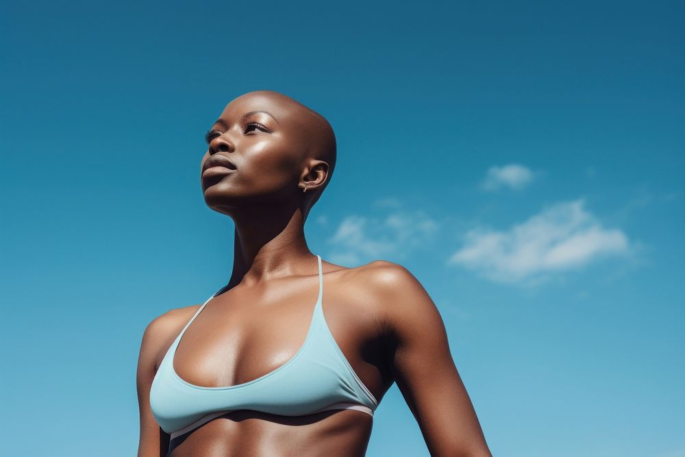 Black bald woman swimwear adult sky. AI generated Image by rawpixel.