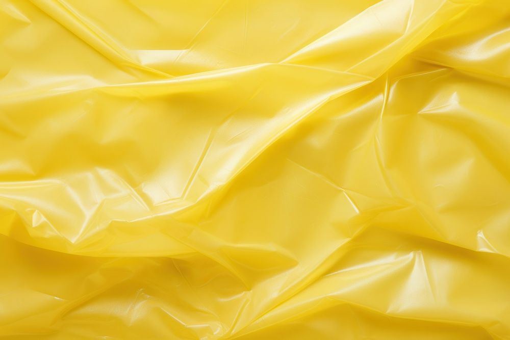 Plastic texture yellow backgrounds crumpled. AI generated Image by rawpixel.