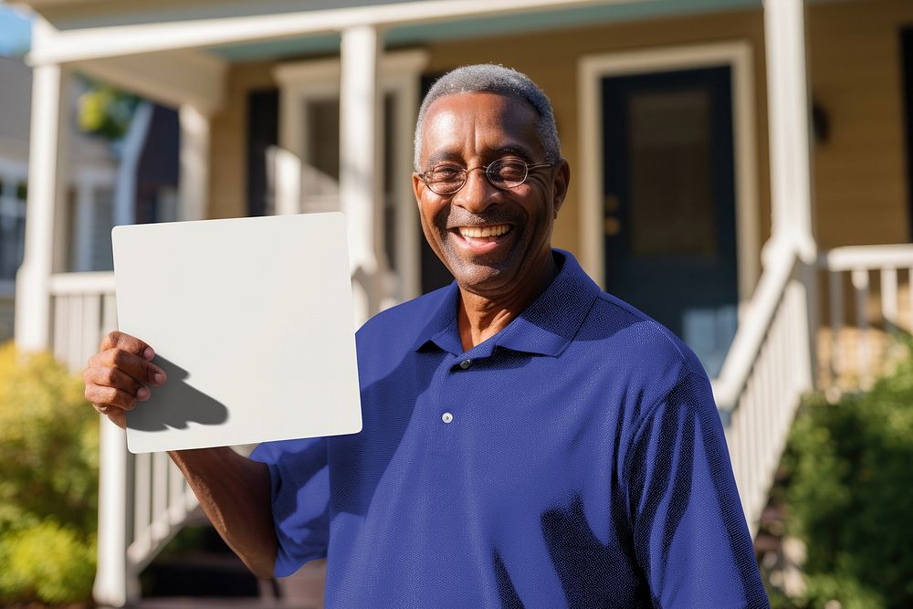 Senior man holding blank sign