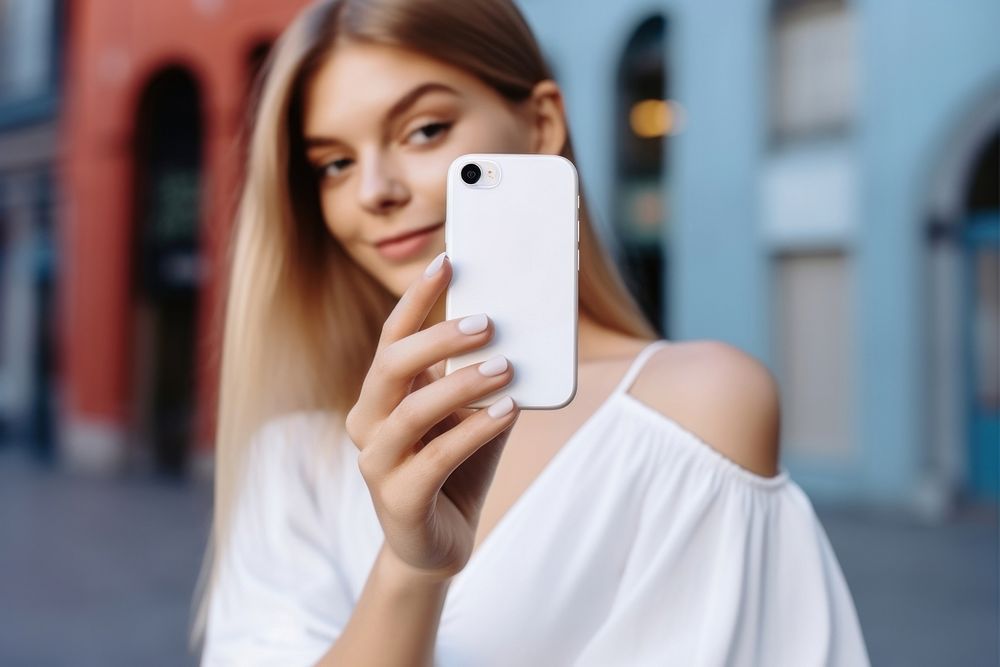 White smartphone selfie adult woman. AI generated Image by rawpixel.