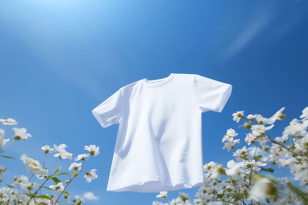 T-shirt flower sky outdoors. AI generated Image by rawpixel.