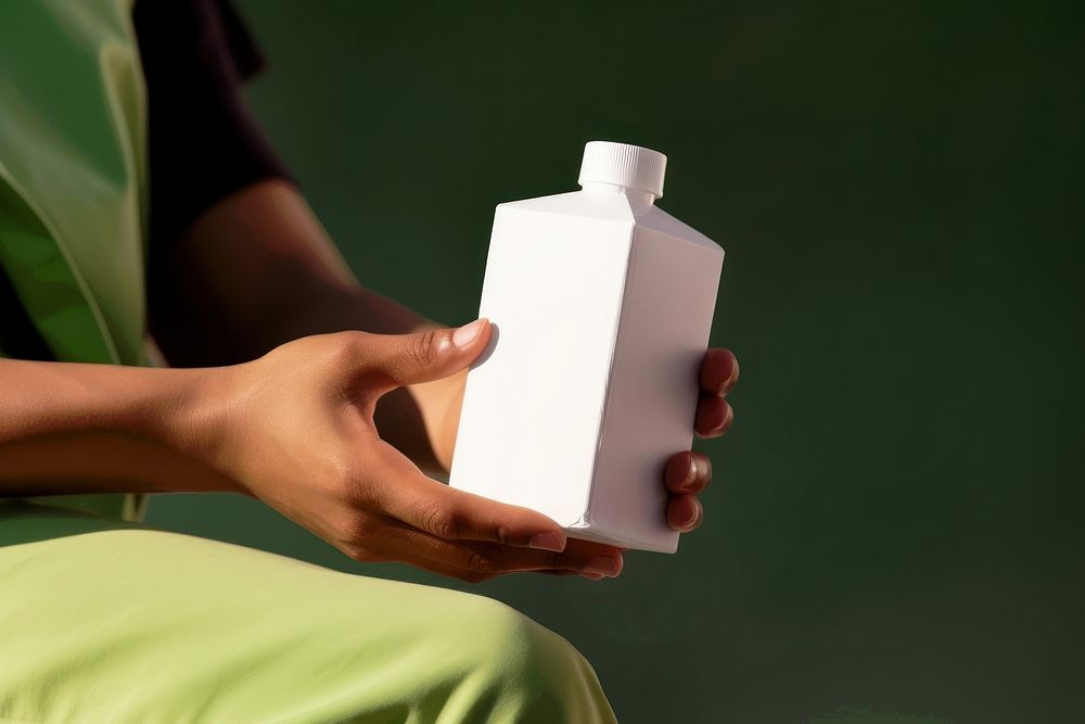 Carton juice box bottle adult hand. 