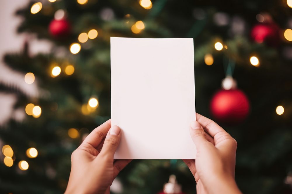 Empty card christmas holding paper. AI generated Image by rawpixel.