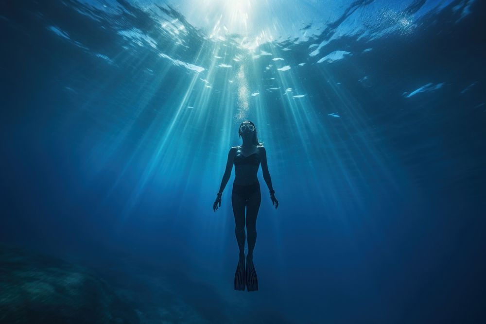 Woman freediving underwater adventure swimming. AI generated Image by rawpixel.