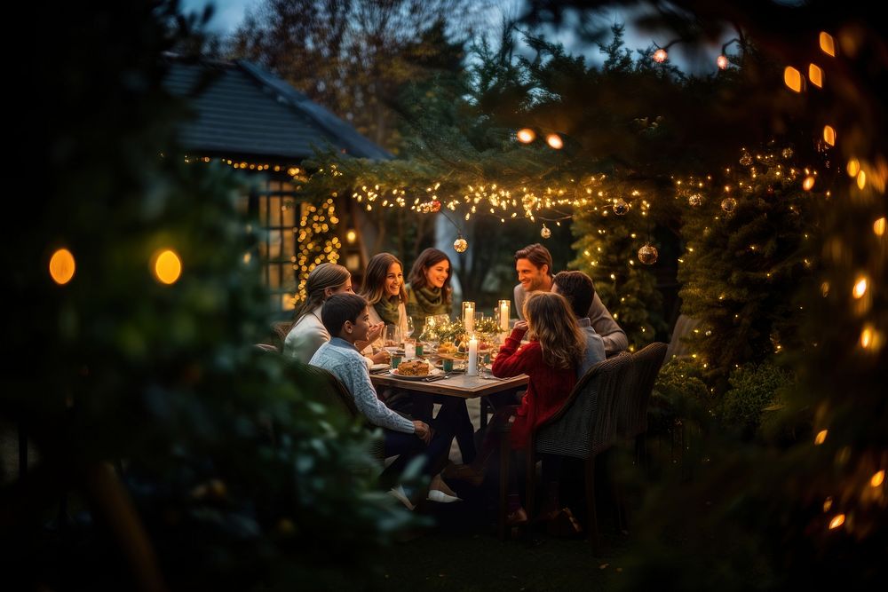Family celebrating christmas outdoors nature dinner. AI generated Image by rawpixel.