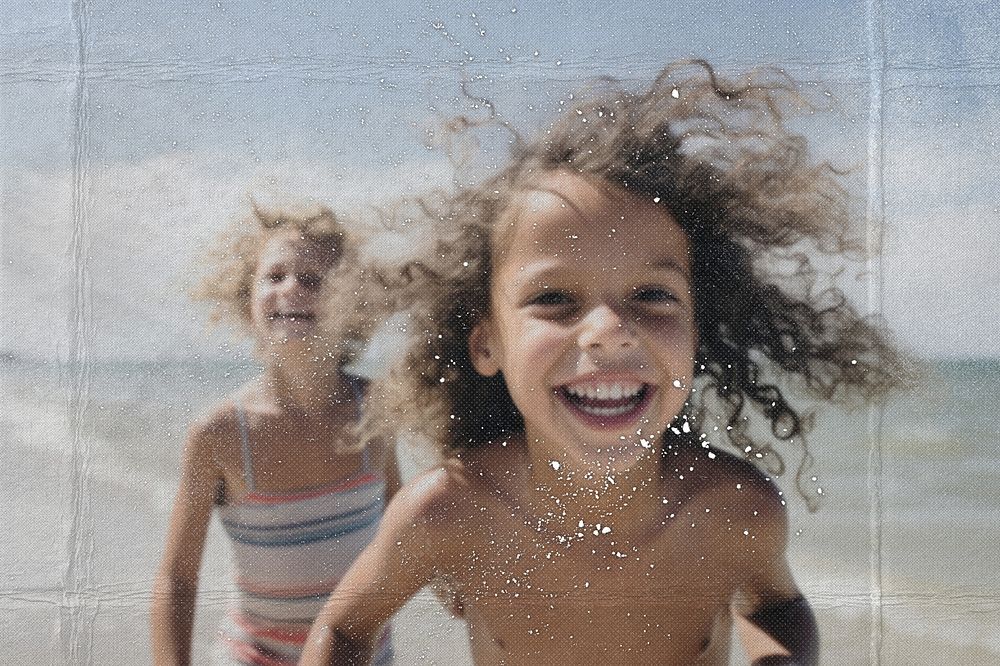 Children on a beach with paper texture effect