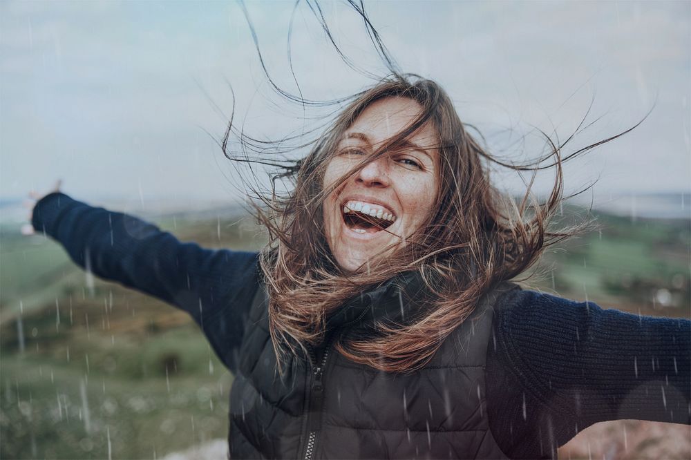 Happy woman in nature, rain design