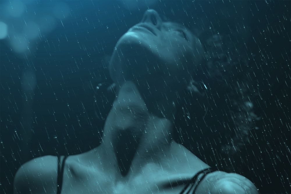 Woman enjoy the rain, dark blue