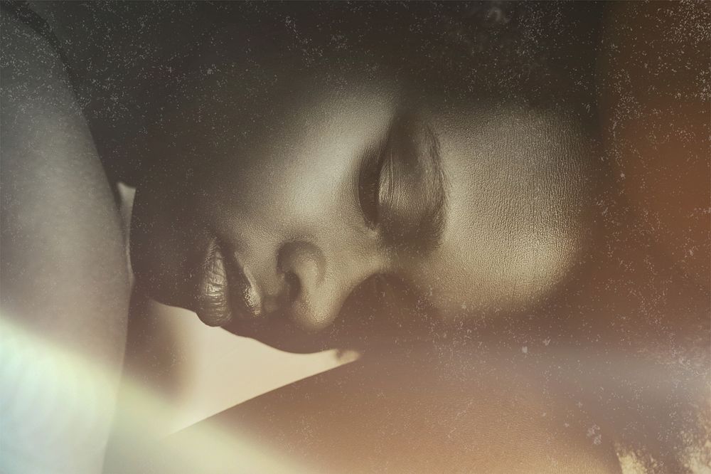 Aesthetic African American woman portrait, light flare