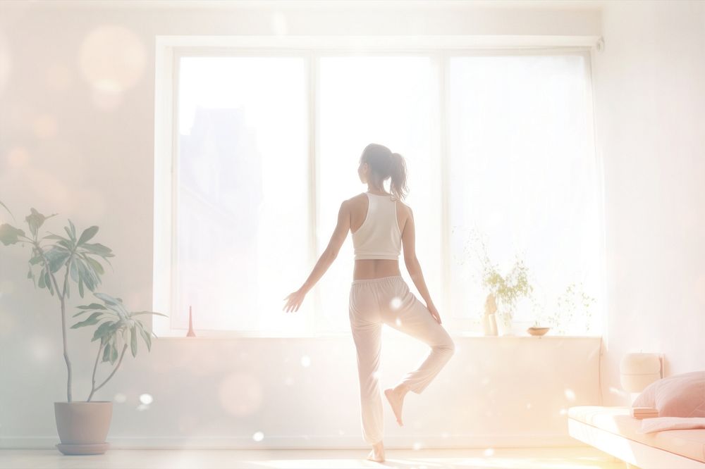 Woman doing yoga at home  with bokeh effect