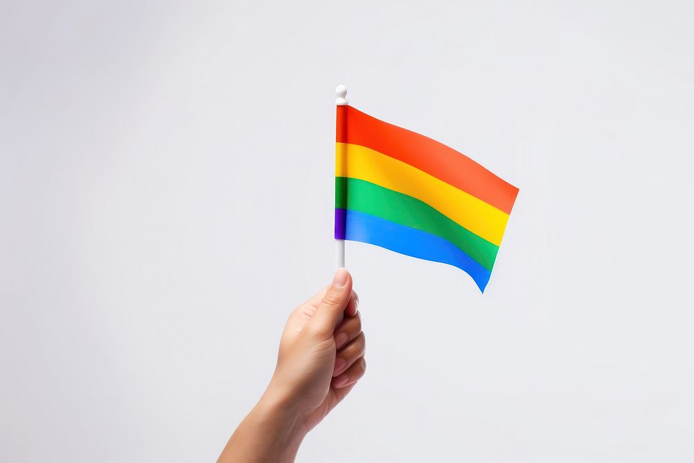 Hand holding pride flag white background celebration patriotism. AI generated Image by rawpixel.