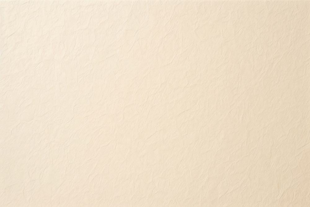 Beige paper texture backgrounds white wall. 