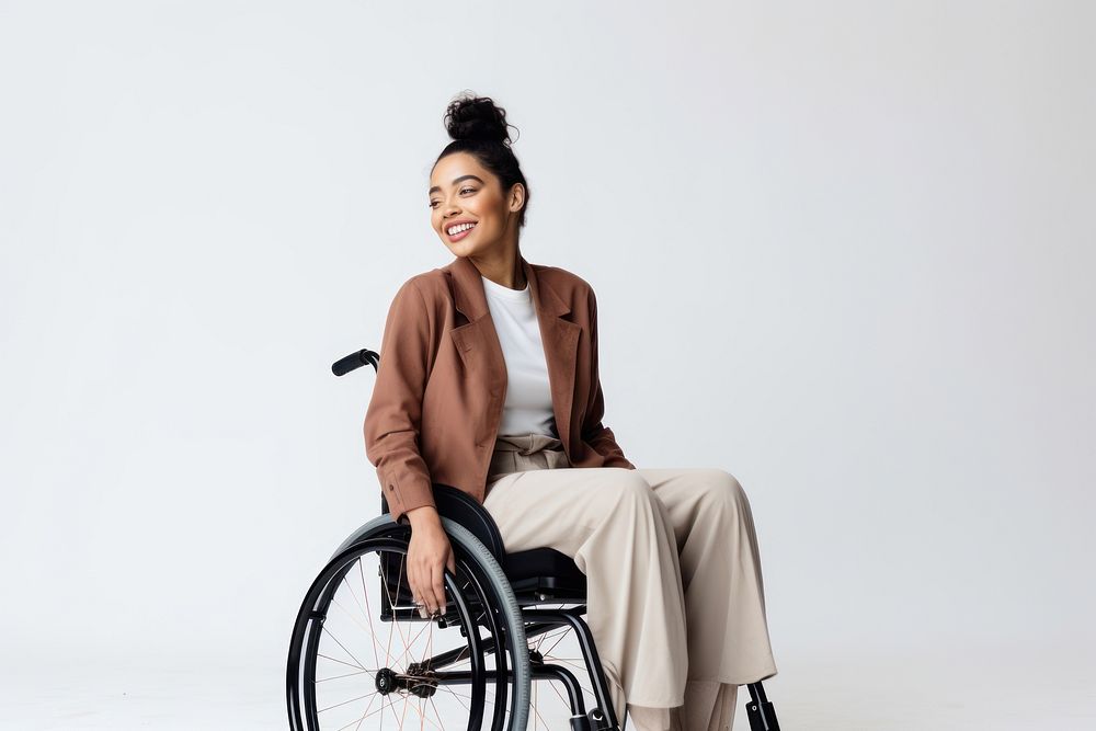 A disabled woman wheelchair sitting smiling. 