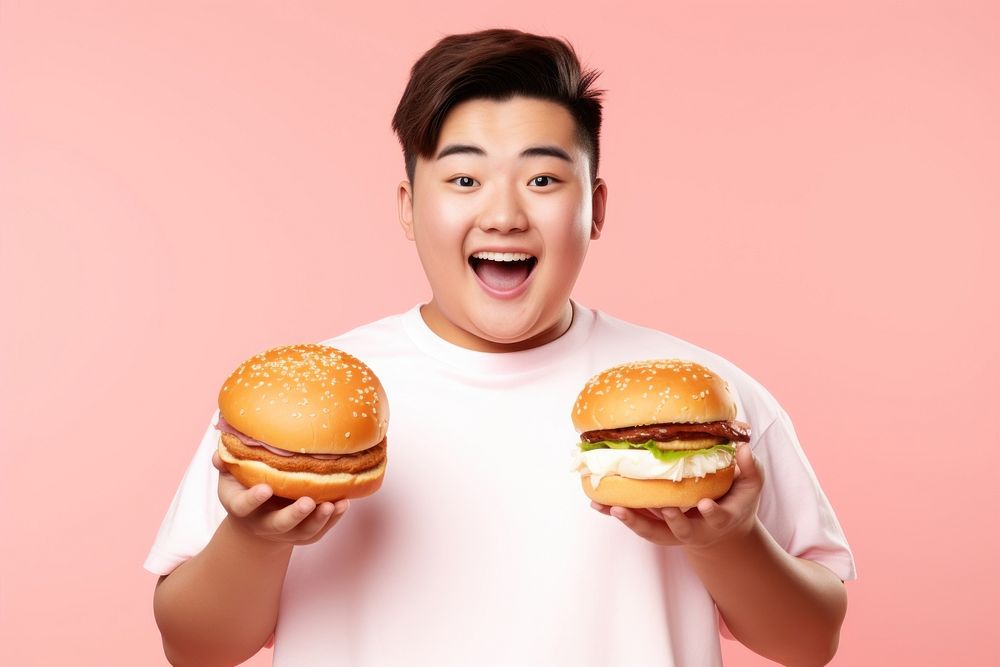 Chinese teenage guy hamburger holding eating. 