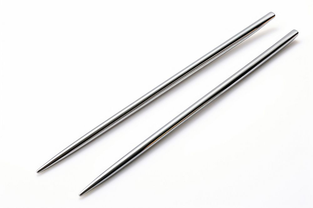 Silver chopsticks white background weaponry needle. AI generated Image by rawpixel.