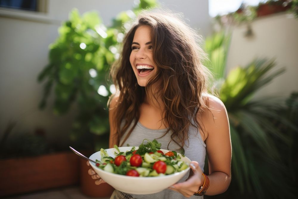 Greek salad adult laughing eating. AI generated Image by rawpixel.