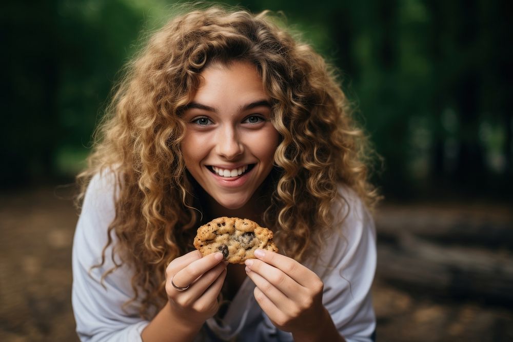 Eating outdoors cookie biting. AI generated Image by rawpixel.