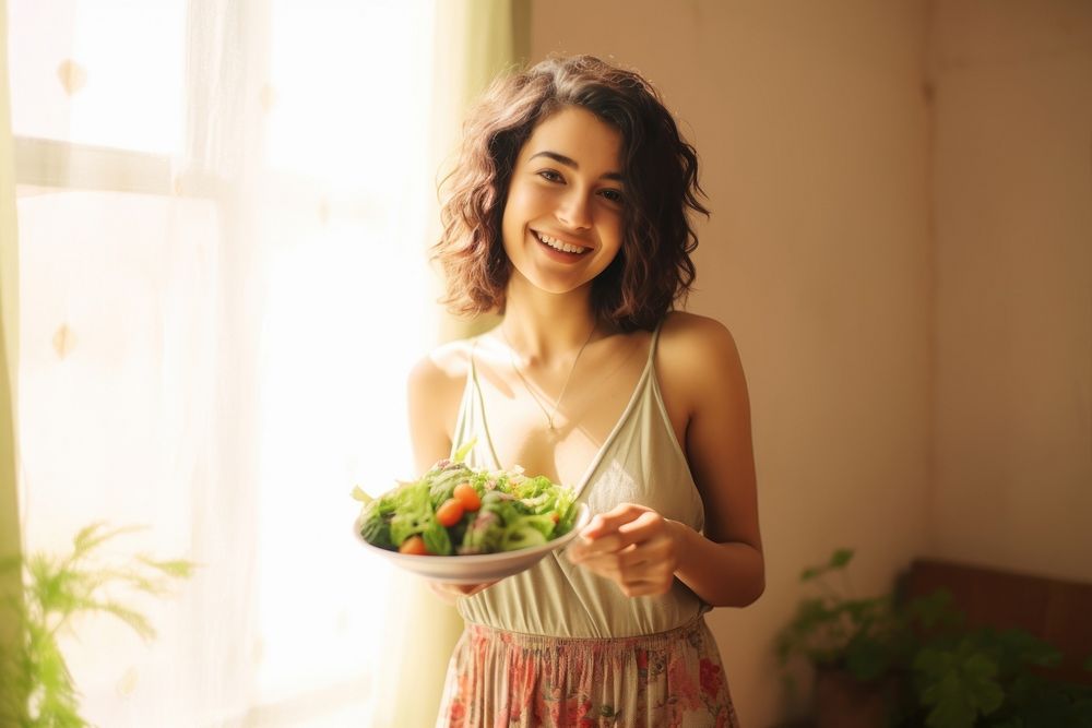 Happy Young woman holding salad adult smile plant. AI generated Image by rawpixel.