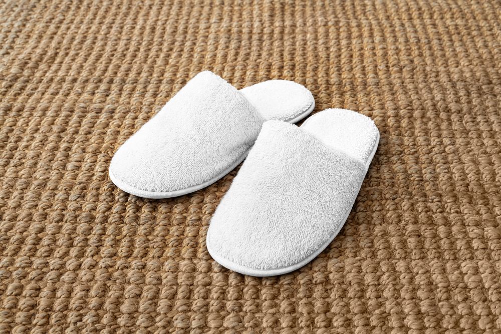 Indoor slippers mockup psd on jute rug
